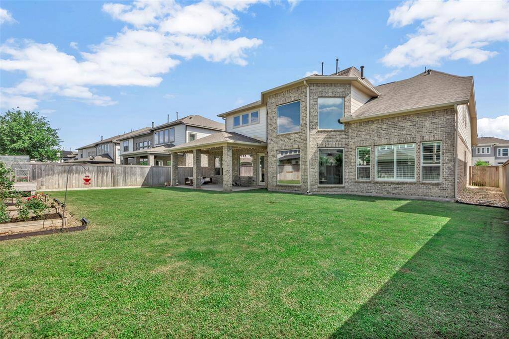 Spacious backyard with irrigated beds for your very own garden