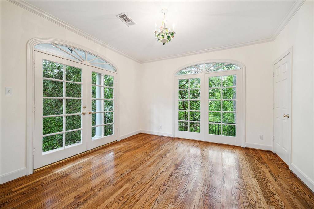 Extra room in the primary suite nestled in the trees.