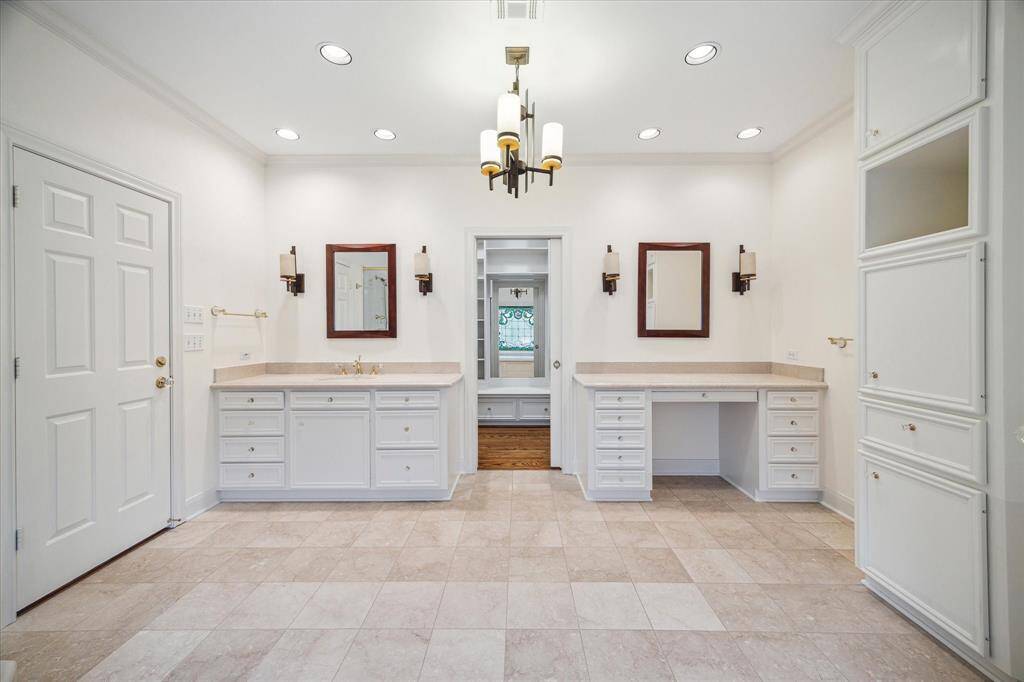 Primary bath with basin and separate vanity area.