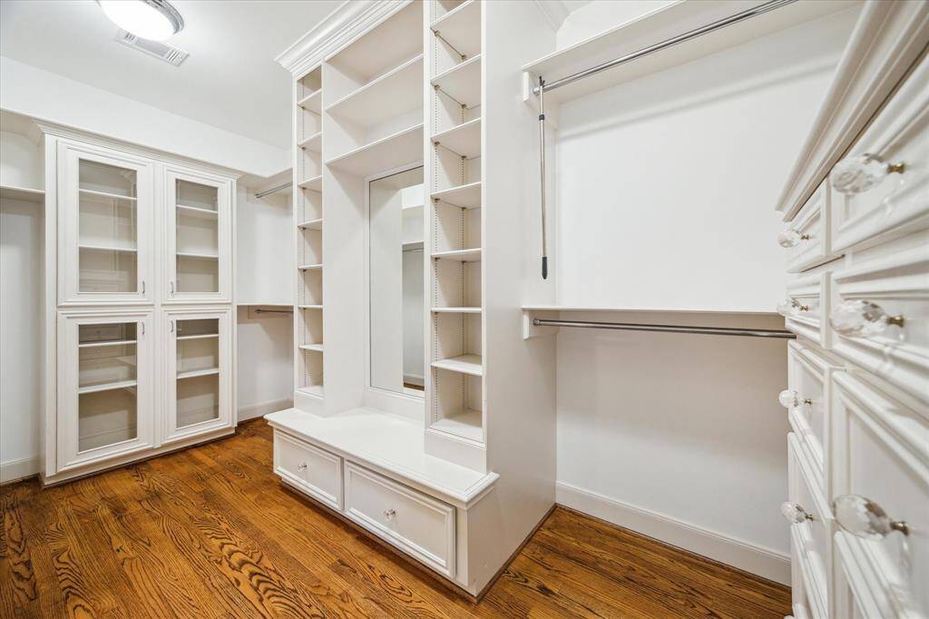Primary 1 closet with abundant storage.