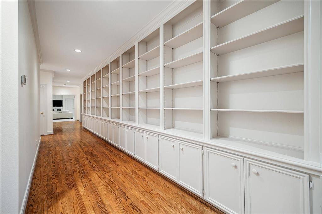 Memory hallway on second level to showcase family photos, sports memorabilia and travel destinations with abundant storage below.