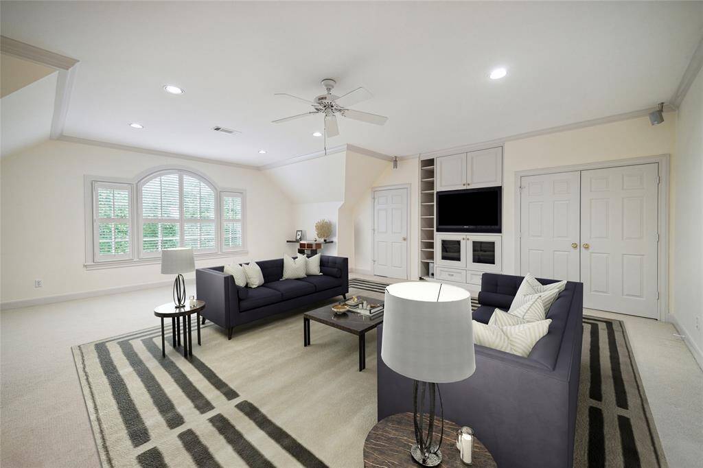 Large second floor game room with plenty of storage and great natural light. (virtually staged)