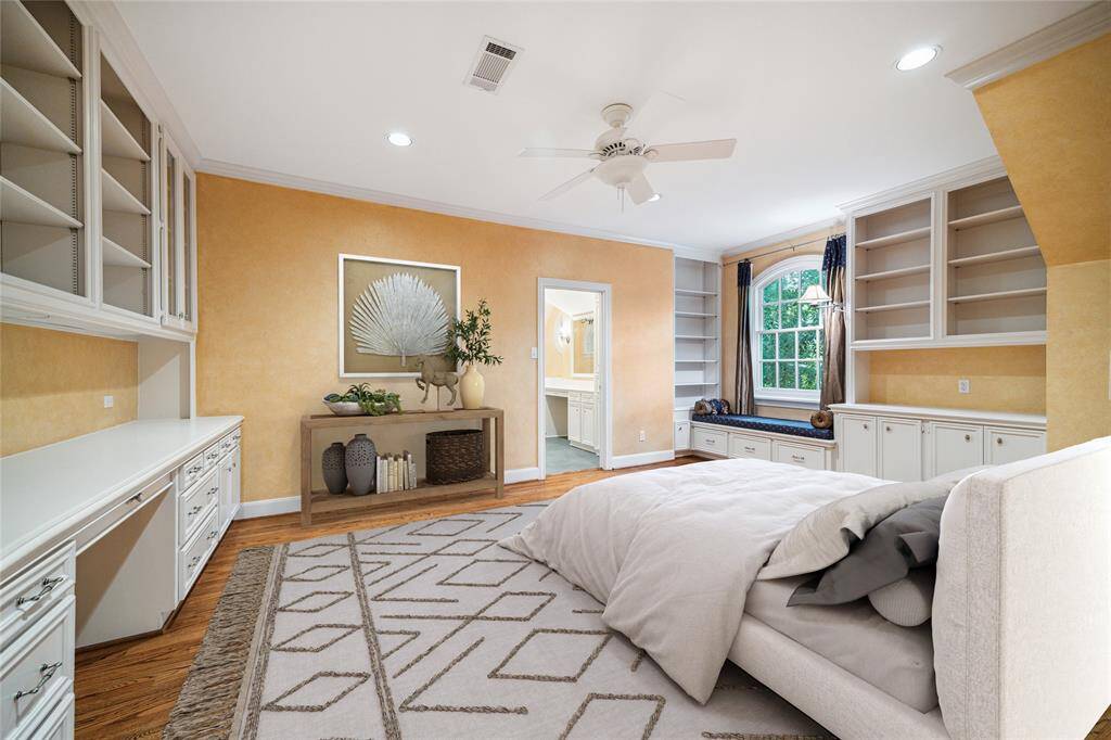 Bed 4 (19x13) Secondary bedroom with beautiful window, charming window seat, built-in desk, cabinets and bookshelves. (virtually staged)