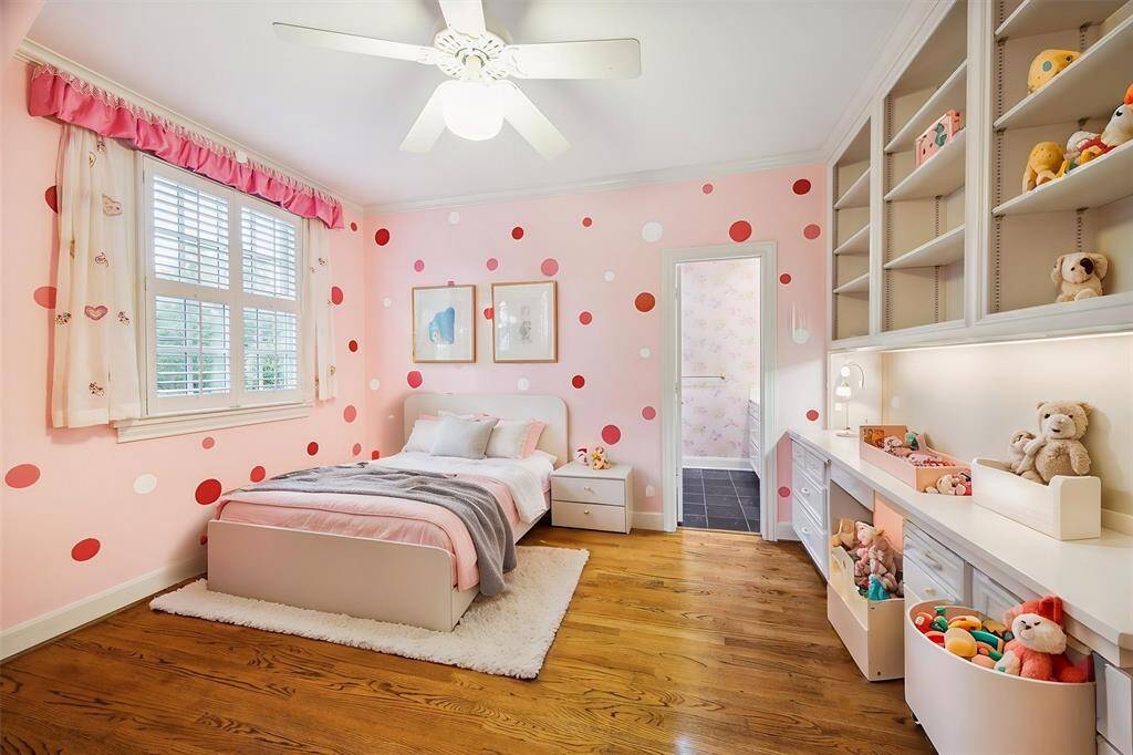 Bed 3 (13x12) Secondary bedroom with built-in desk and bookshelves with Jack and Jill bath. (virtually staged)