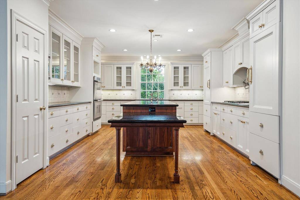 Beautifully appointed kitchen with front facing window.
