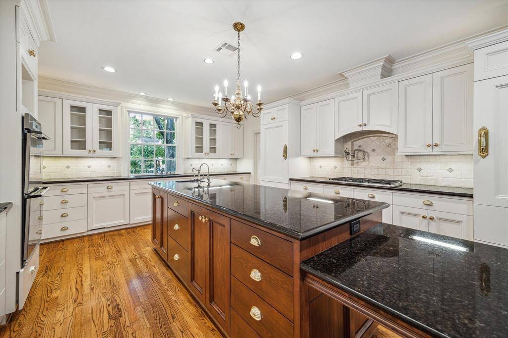 Wonderful kitchen with front facing window over sink plus salad prep sink in island. Plenty of countertop space and storage.