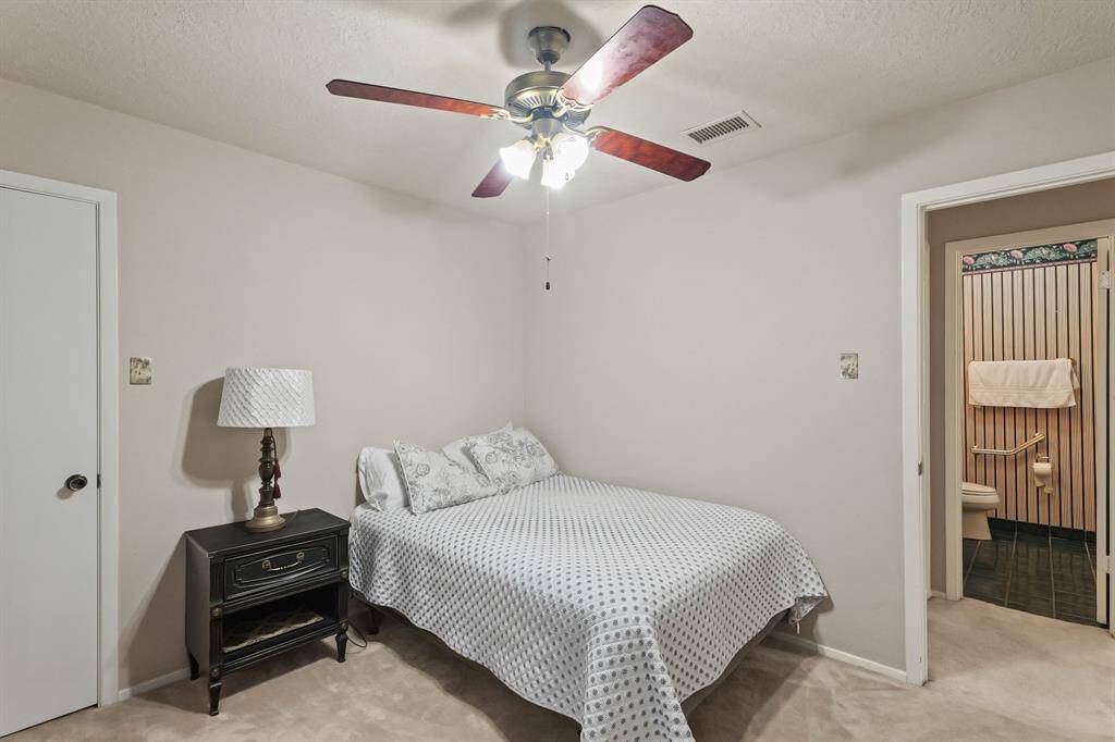 Bedroom #2. Soft carpet and classic ceiling fan for ultimate comfort.