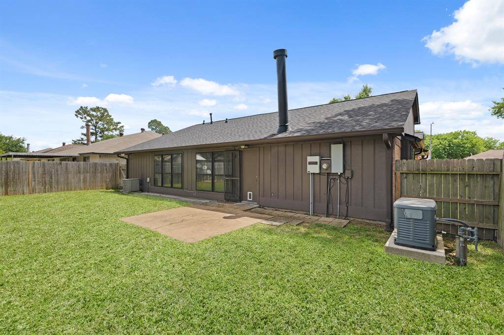 Spacious yard with a roof that is one year old.