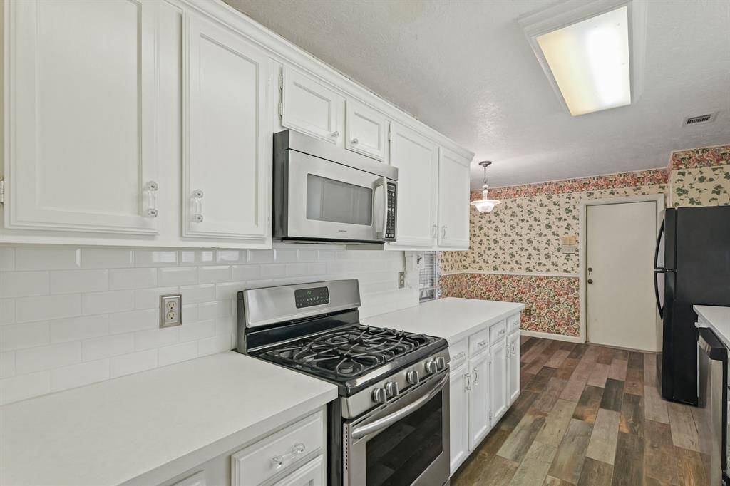 Stainless steel appliances paired well with white cabinetry.
