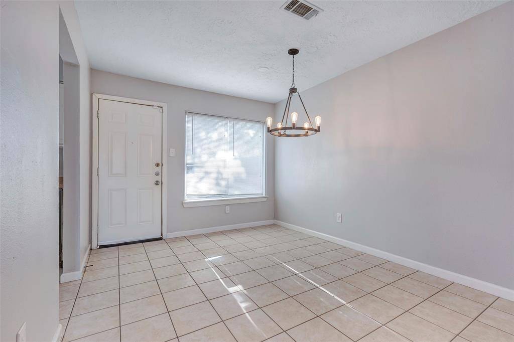 This additional photo provides a clearer look at the dining area, showcasing its size and layout.