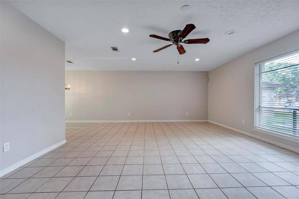 Imagine transforming this spacious living room into your personal haven—perfect for relaxing evenings or entertaining family and friends in comfort and style.