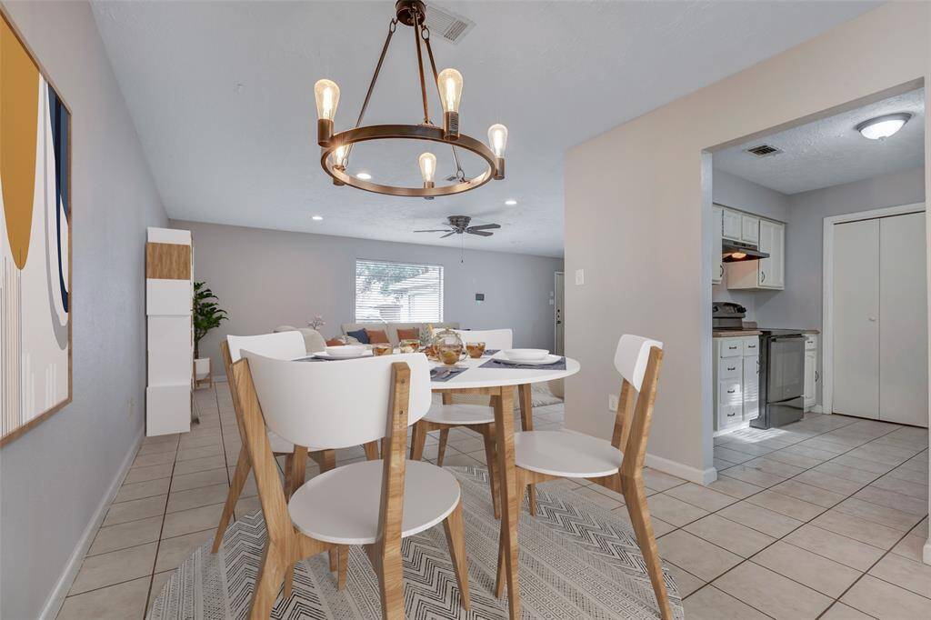 This additional view highlights the seamless flow between the living room, dining area, and kitchen—an open-concept layout that enhances connectivity and maximizes space.