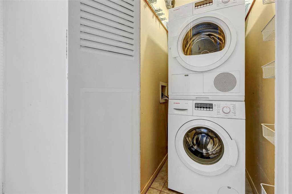 Convenient washer and dryer connections located right beside the walk-in closet for easy laundry access.
