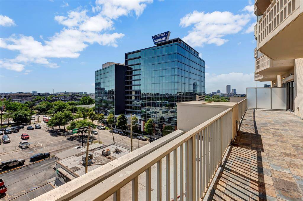 Enjoy a scenic view from the terrace, overlooking neighboring buildings and surrounding areas for a glimpse of the local landscape.