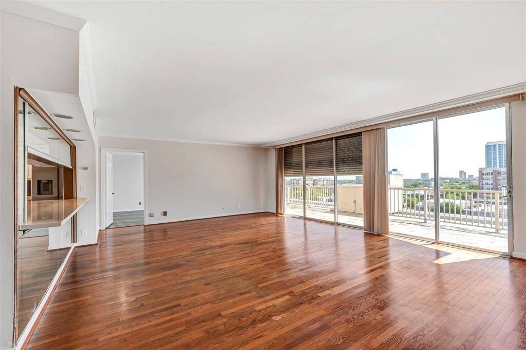 Enjoy the expansive floor-to-ceiling windows that flood the space with natural light.