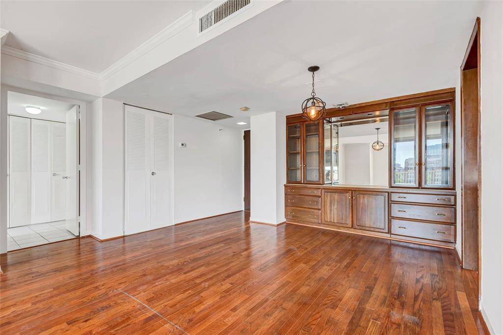 Another angle of the dining room, with the closed doors of the common bathroom conveniently located to the left.