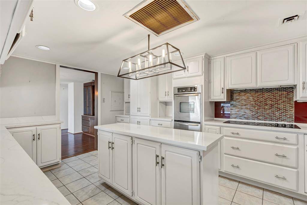 Welcome to the kitchen! Featuring a central island, it's perfect for meal prep and casual gatherings.
