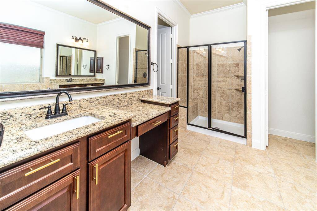Master bath retreat with a double vanity, soaking tub, and walk-in shower.