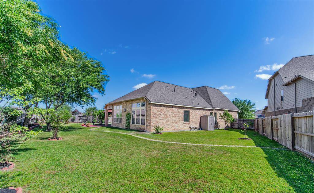 The backyard is perfect for hosting parties. Lots of space for the entire family to enjoy the outdoors!