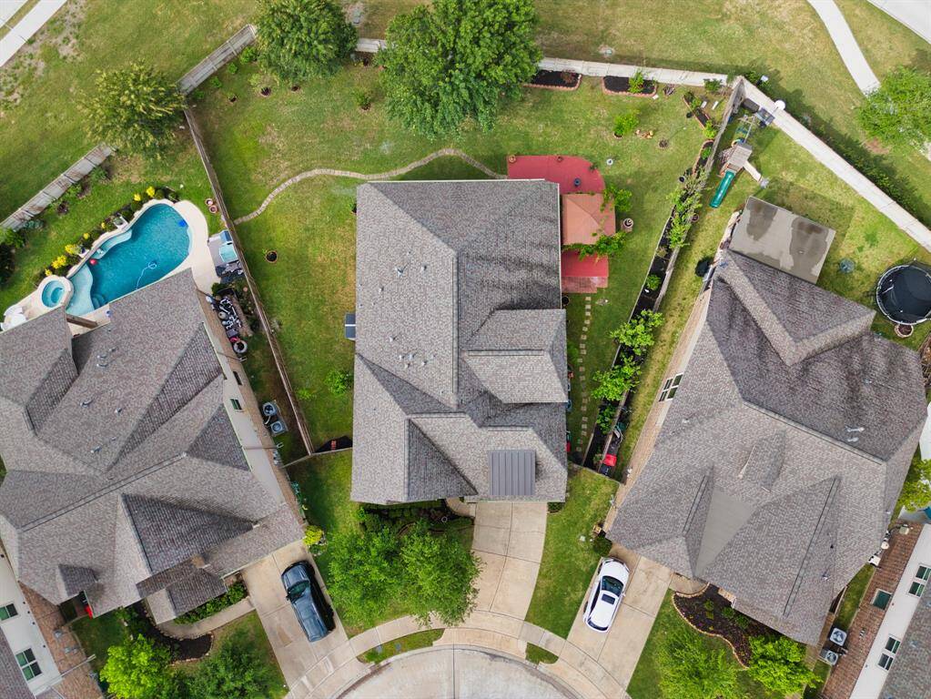 Aerial view showcases a huge, private-cul-de-sac lot with no back neighbors, potential for a pool, and tons of outdoor space!