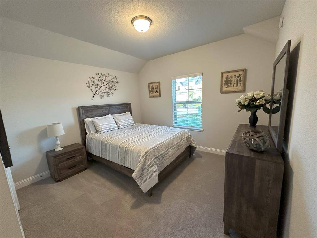A double-door closet, 2-inch blinds for privacy, and a ceiling fan with light for added comfort.
