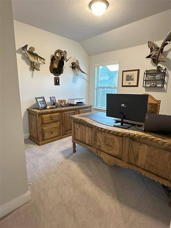 Secondary bedroom features carpet, and a double-door closet.