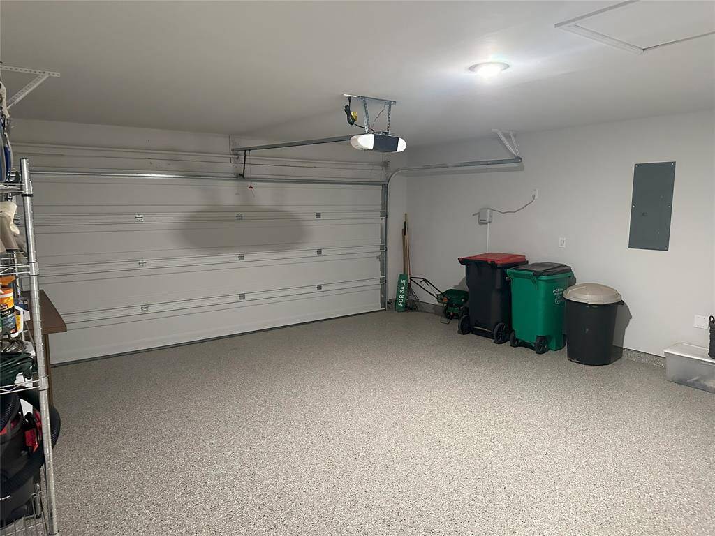 Covered back patio, perfect for entertaining, offering a spacious and inviting area for outdoor gatherings, dining, or relaxing.