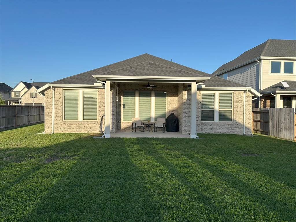 All sides of the home are beautifully finished with durable brick and stone, adding both charm and low-maintenance appeal.