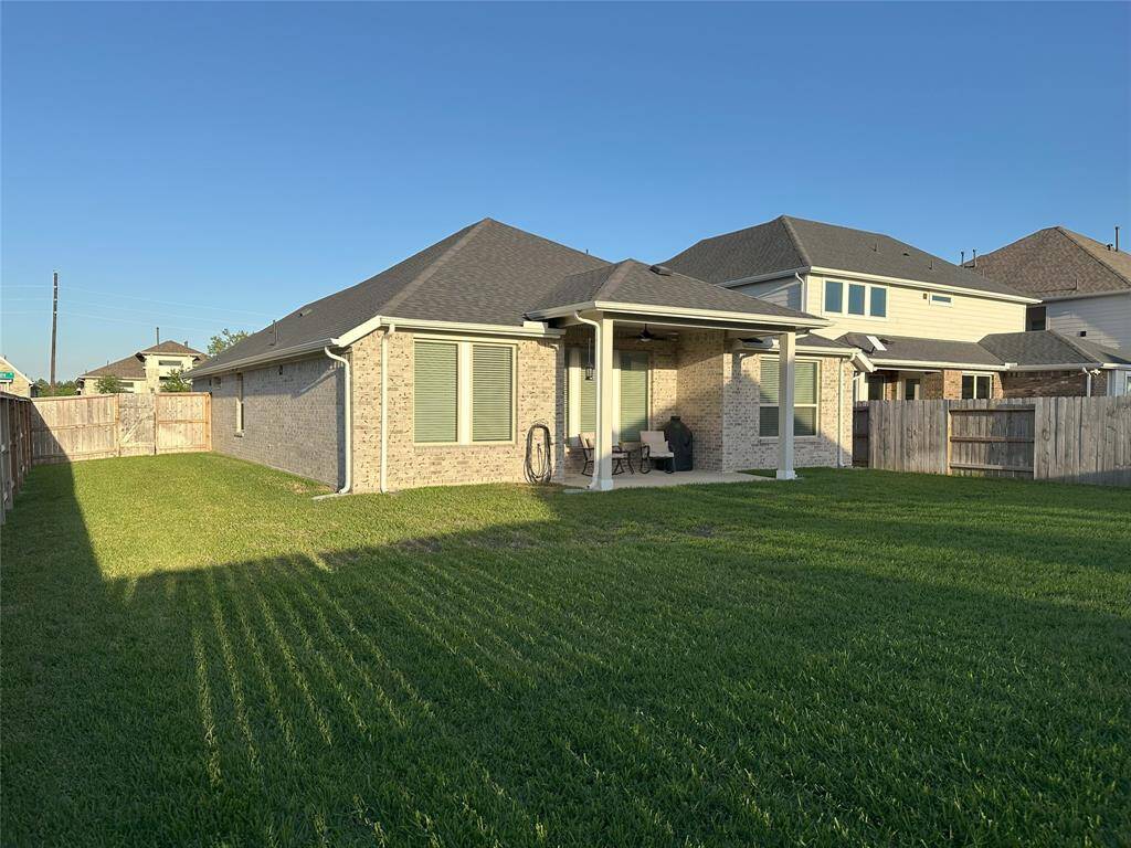 Spacious backyard with plenty of room for your fur babies to run and play, offering a perfect spot for outdoor fun and relaxation.