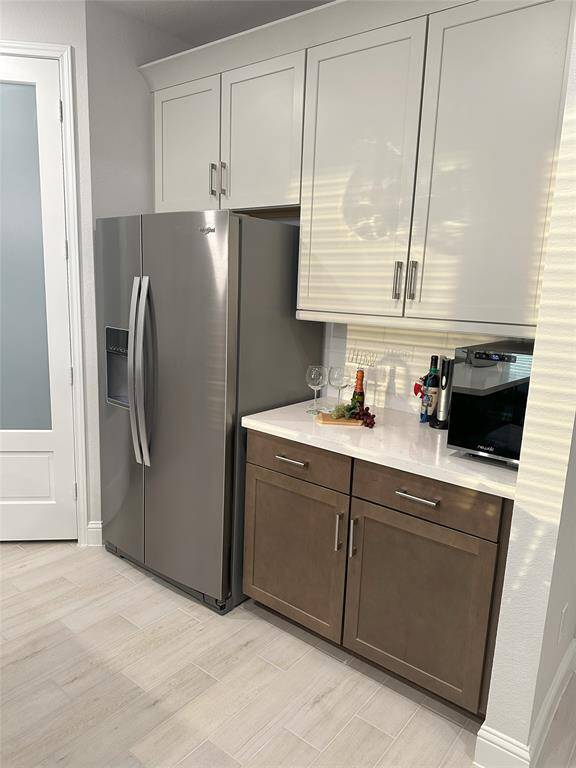 Additional cabinets ensure organized and convenient kitchen storage.