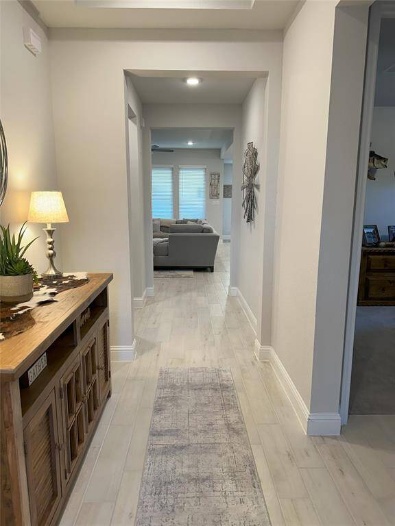 The living room features sleek tile floors.