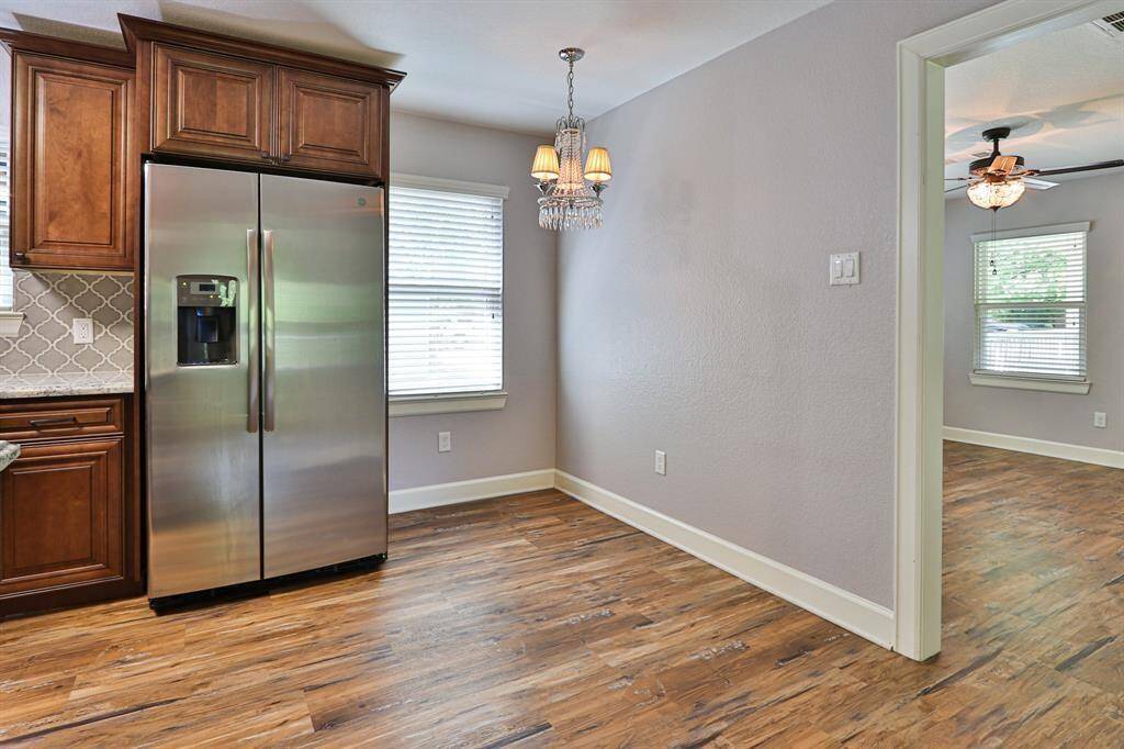 Welcome to this sophisticated kitchen and dining area..