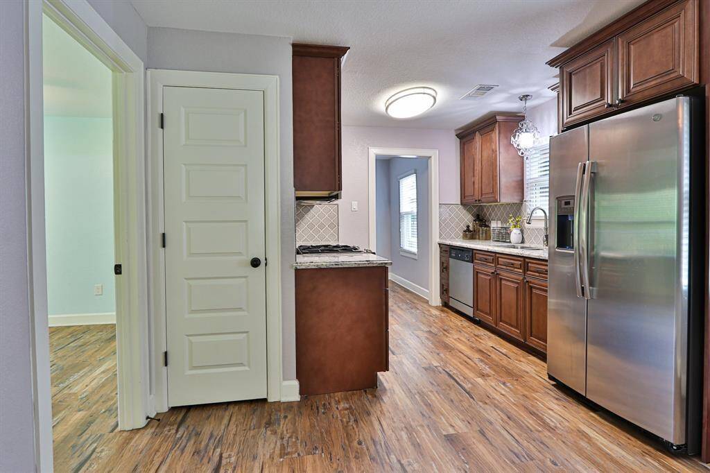 This stunning kitchen and dining space offer both functionality and sophistication.