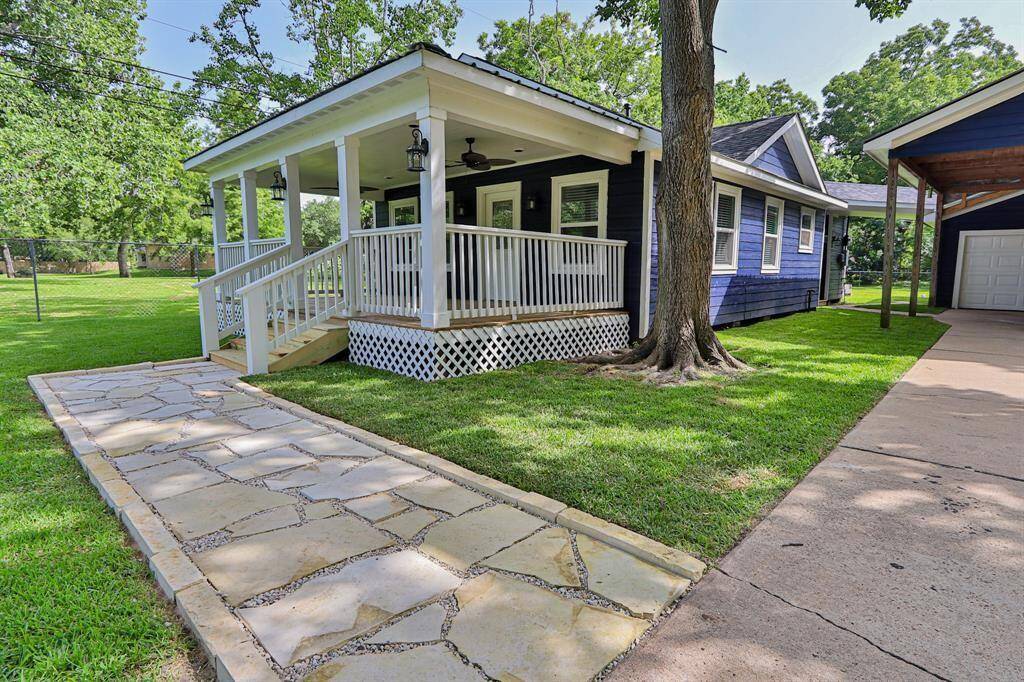 Featuring a picturesque front porch, crisp white railings, and inviting steps that lead to a cozy entrance, this home offers the perfect blend of charm and comfort.