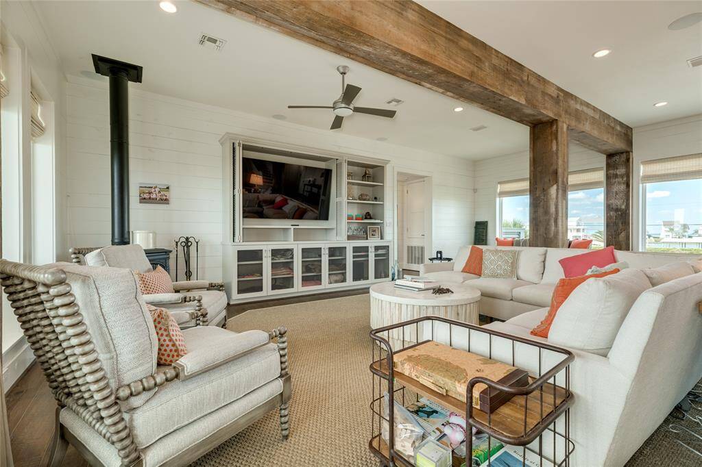 Built-in cabinets and shelves can accommodate a large flat screen television