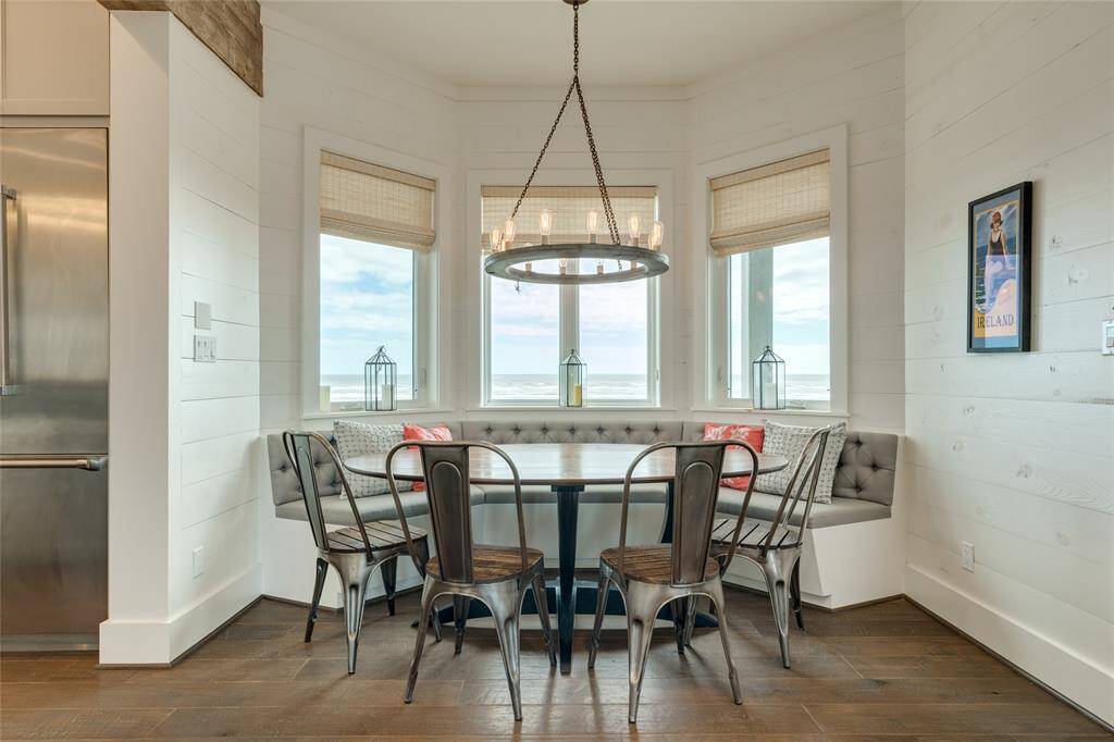 Dining banquet can comfortably seat 10 and features a custom crafted walnut table