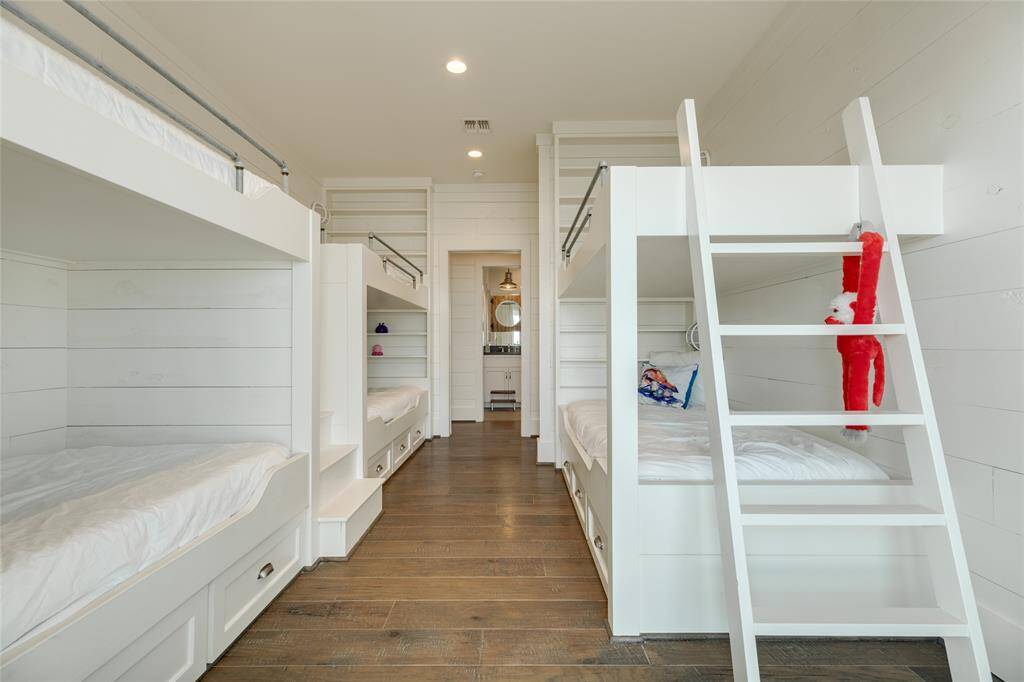 Bunks have underbed storage and individual book shelves