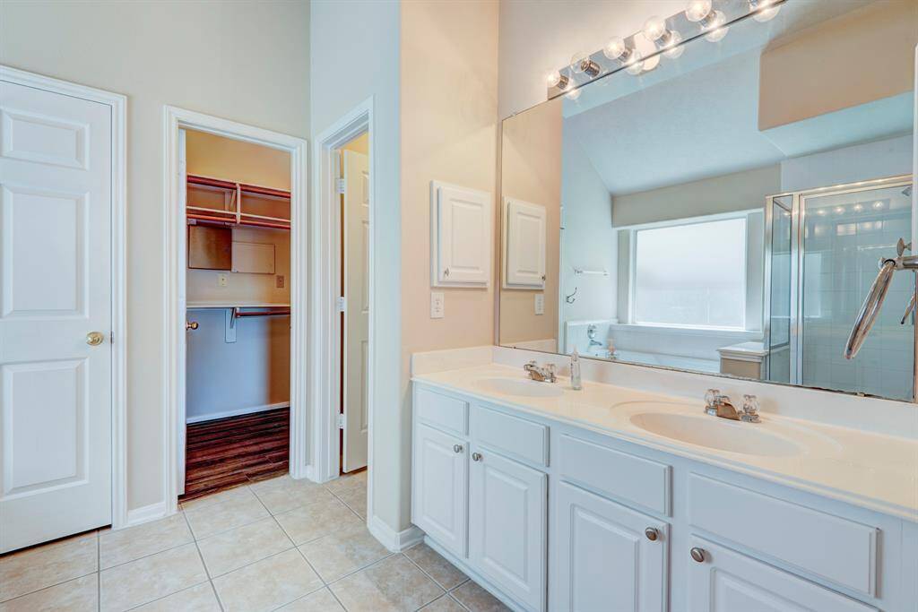 Also features private water closet, double sinks and walk-in closet.