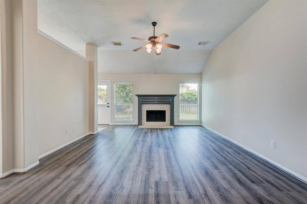 An inviting living room centers around the gas fireplace.