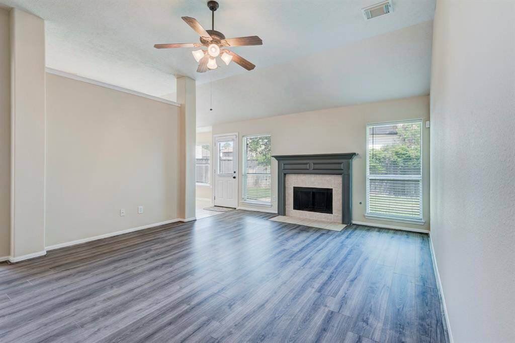 Noticing high ceilings and no carpet.
