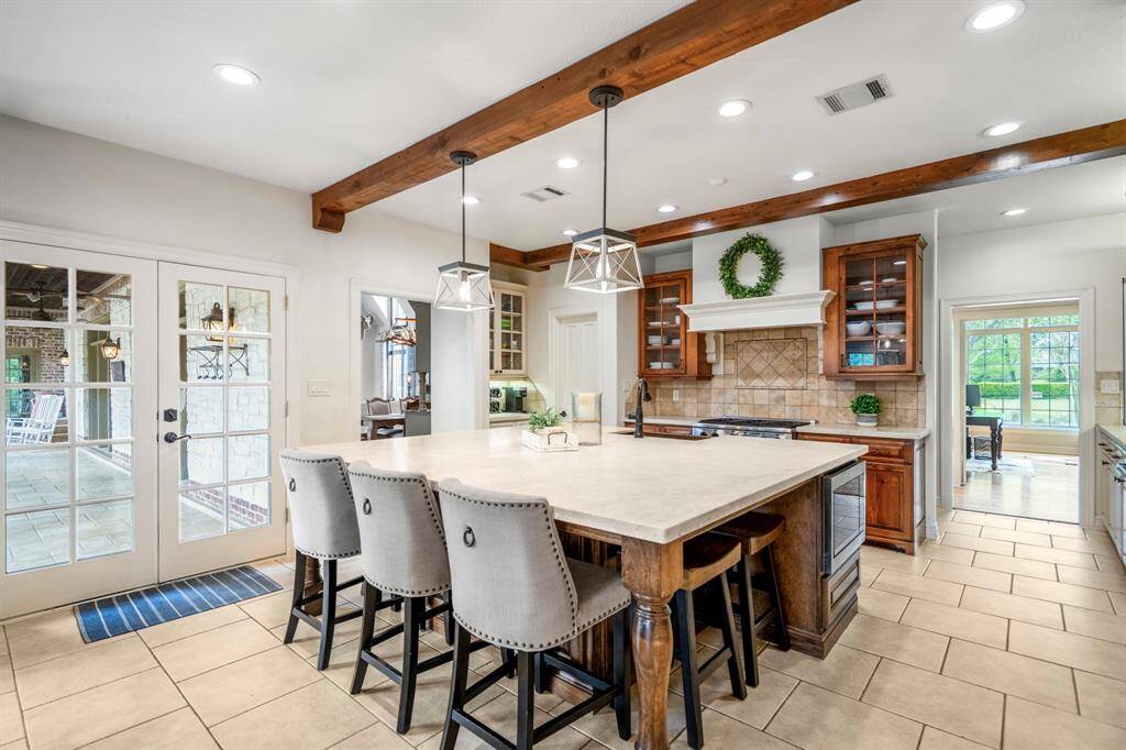 Spacious kitchen with a stylish island perfect for dining and entertaining.