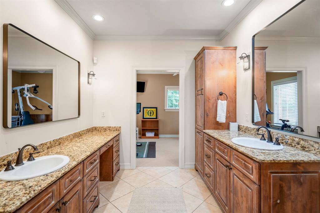Primary bathroom featuring elegant double vanities for a touch of sophistication and convenience.