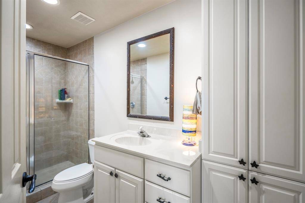 Secondary Bathroom with a walk-in shower