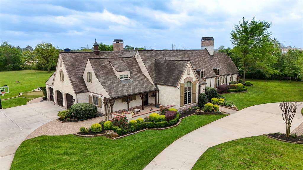 Large three car garage ann a circular drive in the front of the home as well.