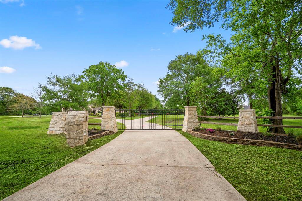 Experience exclusive living on this 5-acre estate, accessed through a private gated entrance.