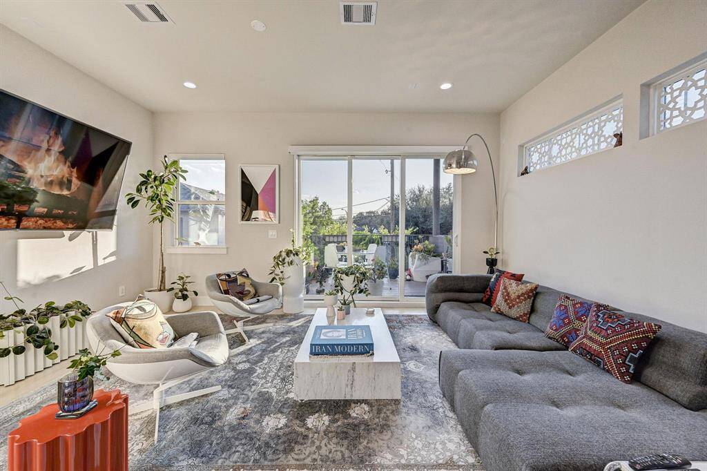 Livingroom with views of the private, landscaped yard