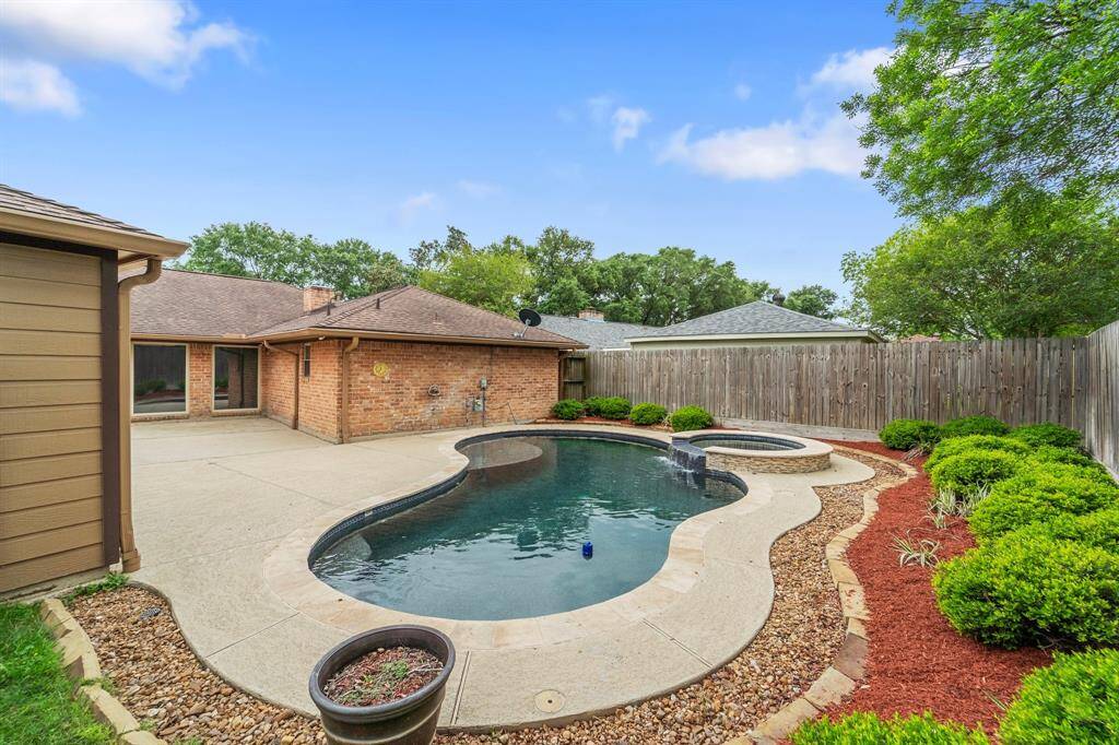Look at your backyard oasis! This backyard offers an INCREDIBLE sparkling pool & spa, and an oversized patio making this an entertainers paradise!