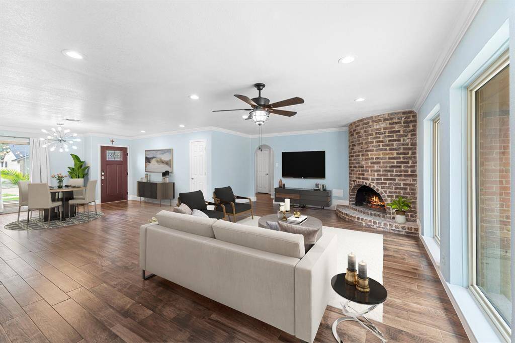 Virtually Staged: WOW! This living room is the perfect place to entertain family and friends as it offers a seamless, open floor plan. Easy access to your dining area.