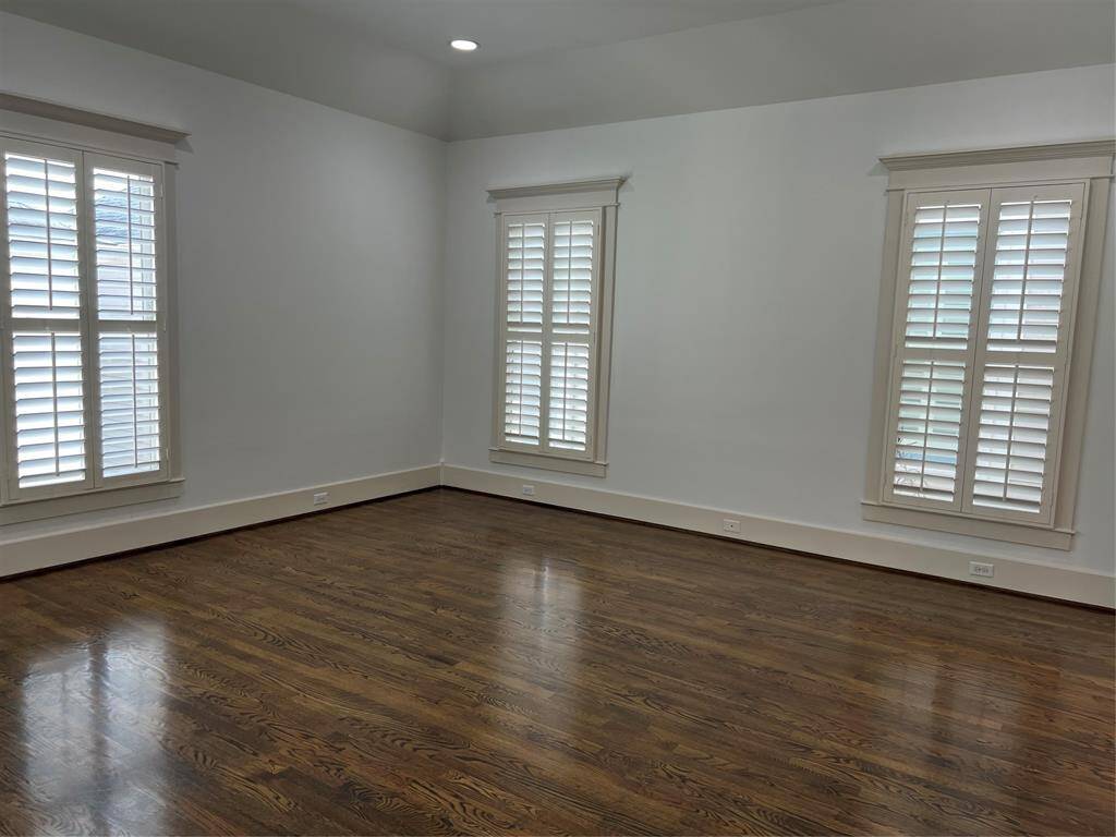 Primary suite is nice and large. Tall ceilings and shutters on all the windows.