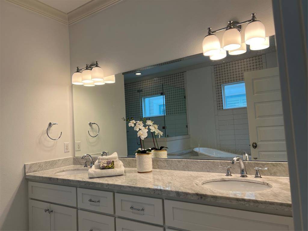 Primary Bathroom offers double sinks and granite countertops